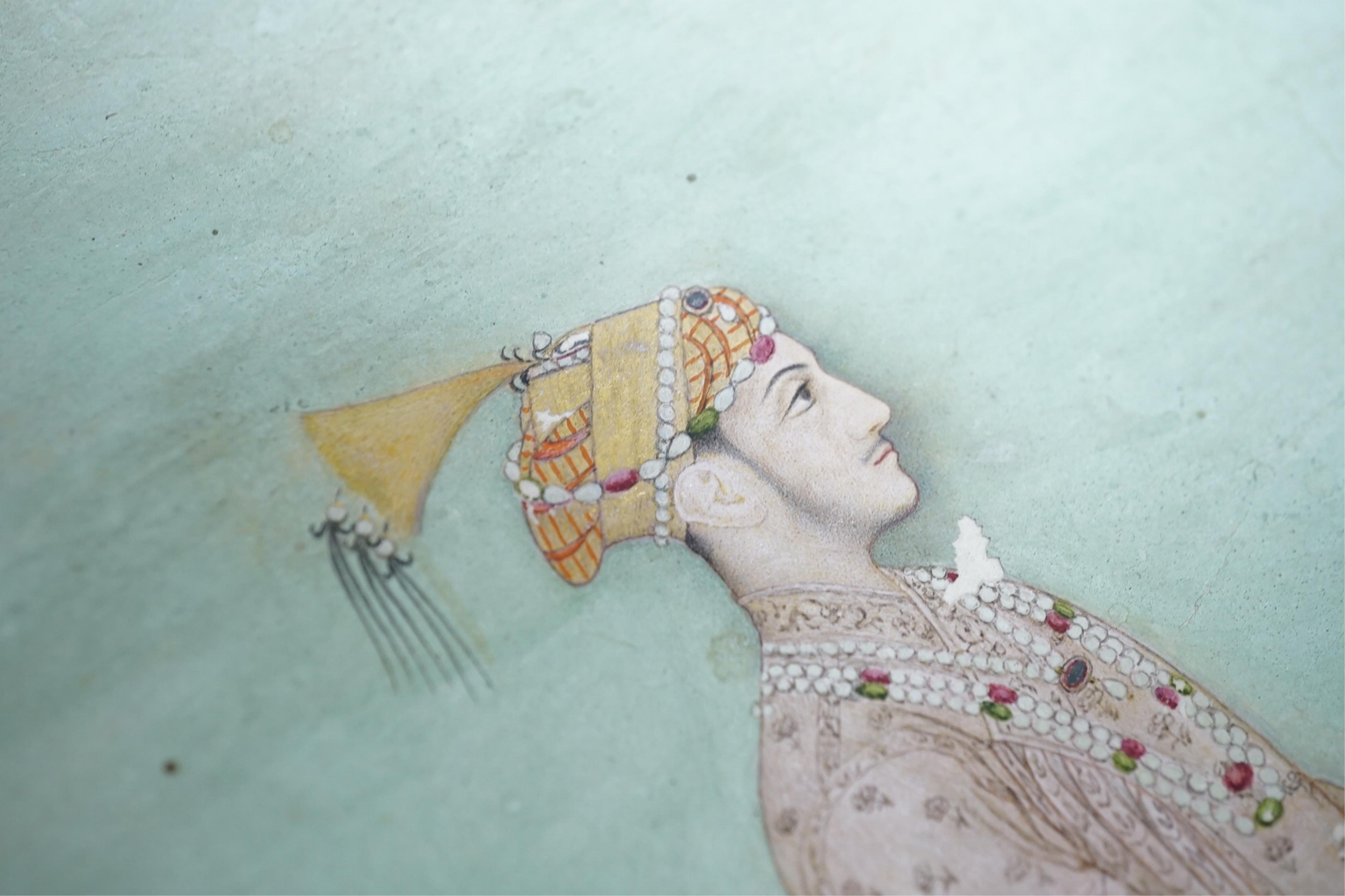 Mogul (Mughal) School , Profile Portrait of a Mogul dignitary, possibly Shah Jahan (1592-1666), full length, wearing court attire and a sword, standing in a landscape, watercolour miniature, 31cm x 20.5cm including borde